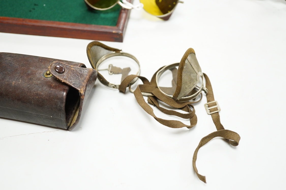 A pair of early 20th century Theodore Hamblin safety goggles with mesh wire sides, with original case, a pair of prescription mesh sided safety glasses, a pair of faux tortoiseshell safety glasses and a pair of Willson,
